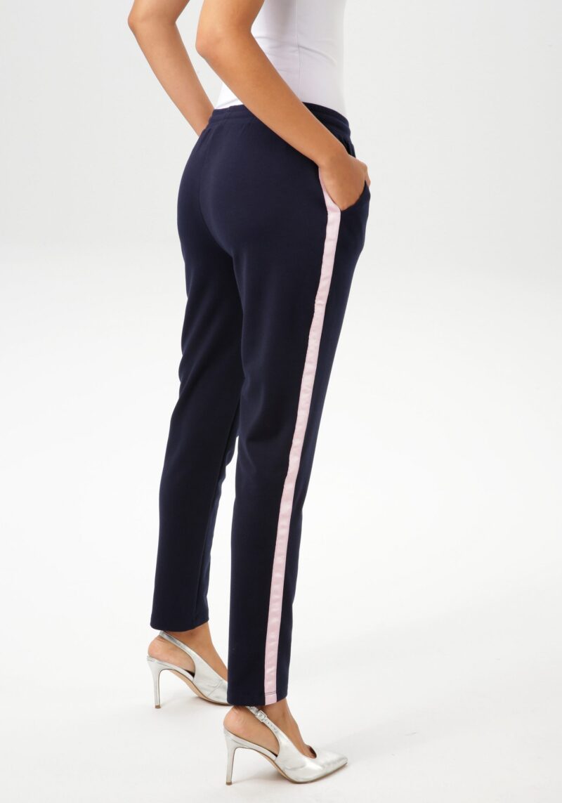 Pull-on trousers with pink tape on the side seams - Image 2